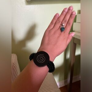 Black beaded stretch bracelet with spiral pattern